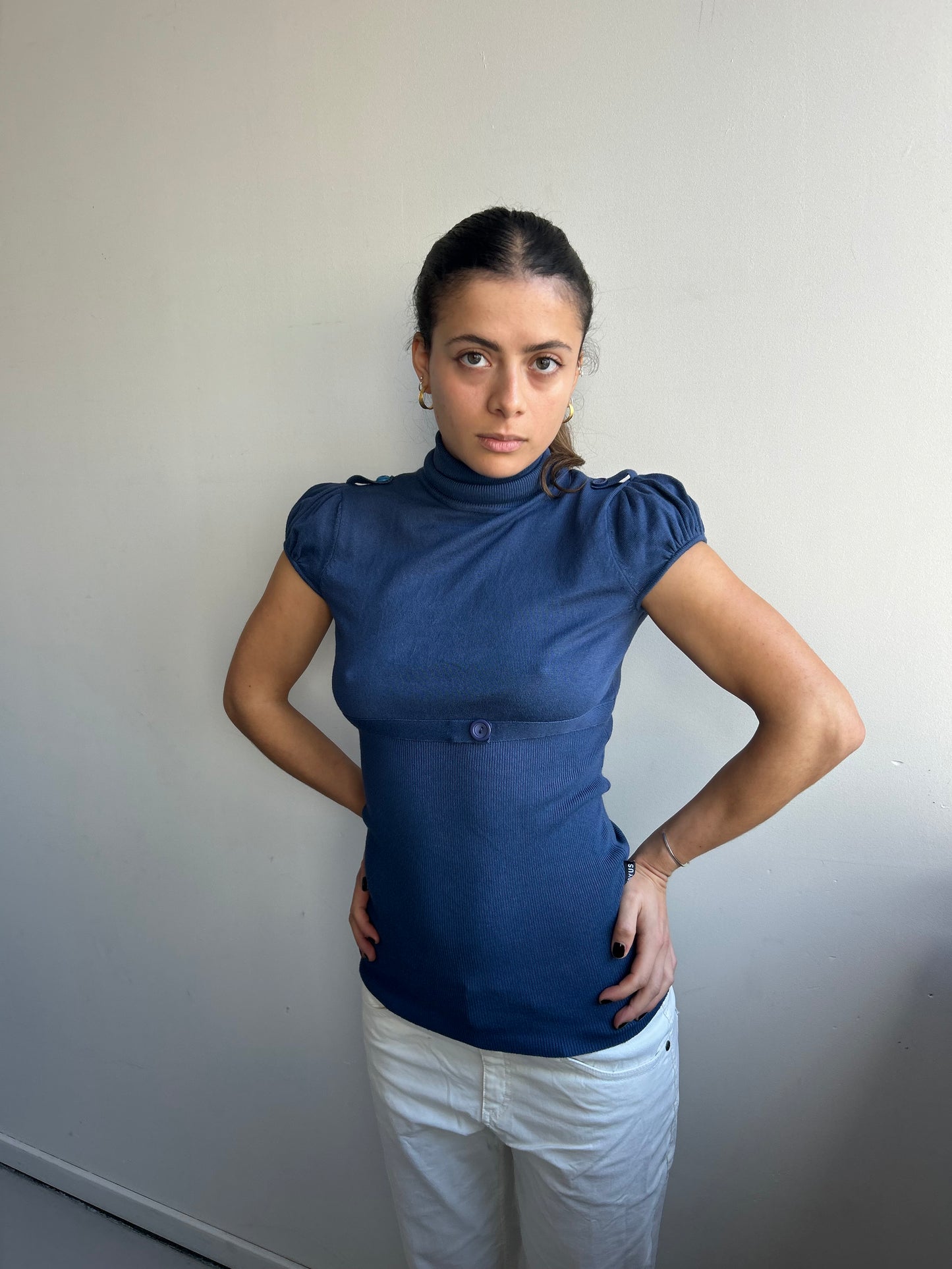 Navy turtleneck with puff sleeves and waistband
