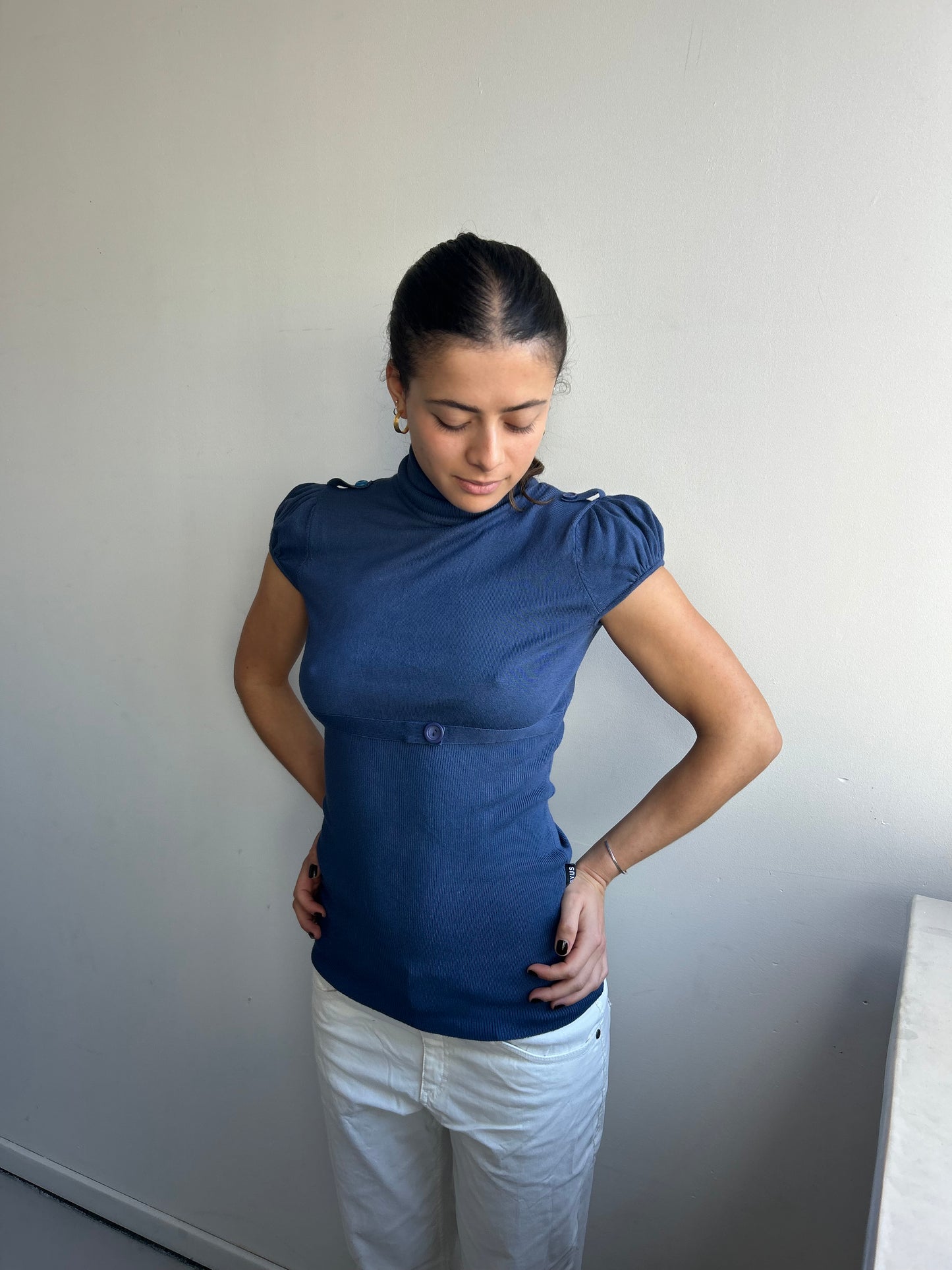 Navy turtleneck with puff sleeves and waistband