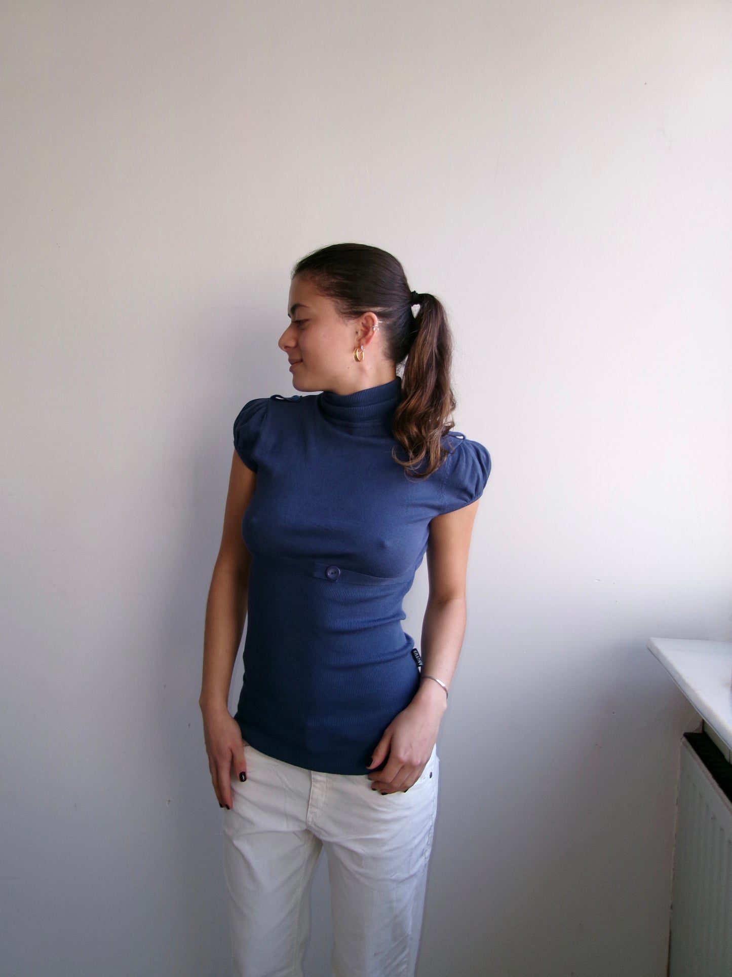 Navy turtleneck with puff sleeves and waistband