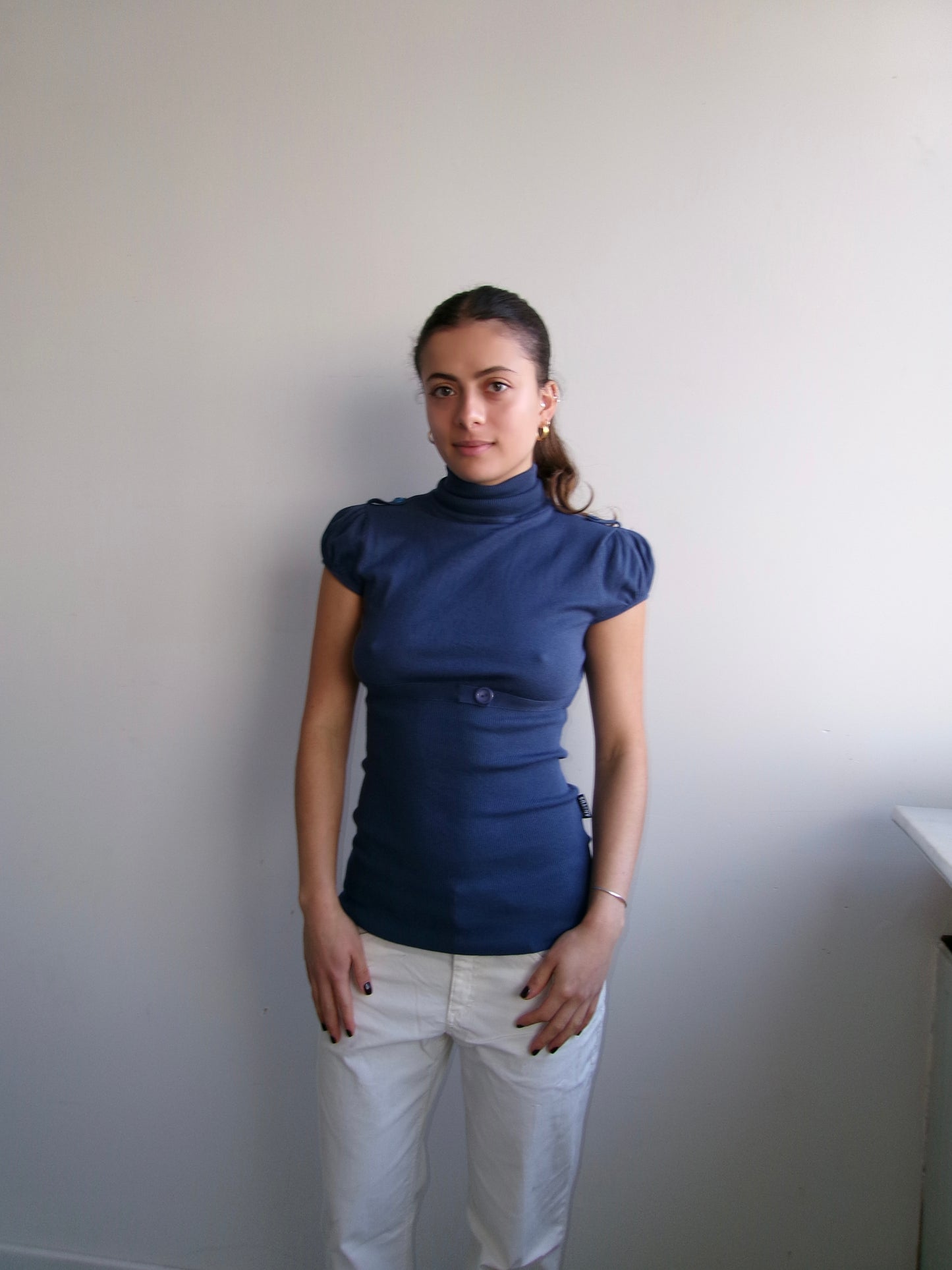Navy turtleneck with puff sleeves and waistband
